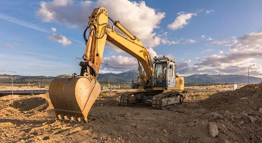 Idle excavator on an empty construction site with no active work
